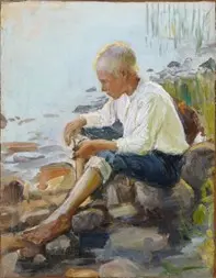 Jeune garçon sur le rivage